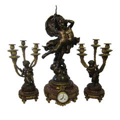 "L' Amour Vainqueur, " French Patinated Bronze Sculpture Clock Set