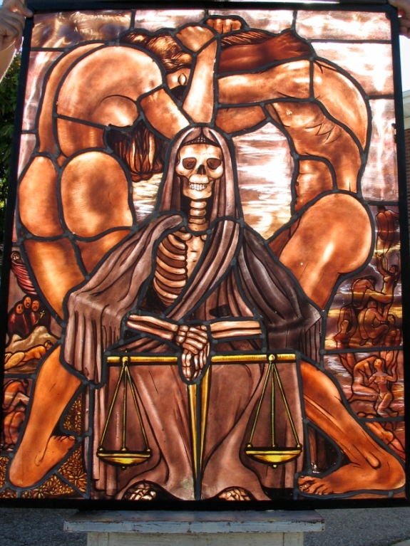 A wonderfully executed eerie stained glass window originating, I believe, from France. I acquired this window by purchasing the contents of an abandoned storage unit. A skeleton representation of Hades, God of the Underworld, seen veiled in his
