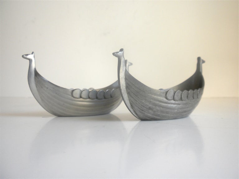 Pair of pewter cellars in the shape of a viking ship by Just Andersen. Both signed.