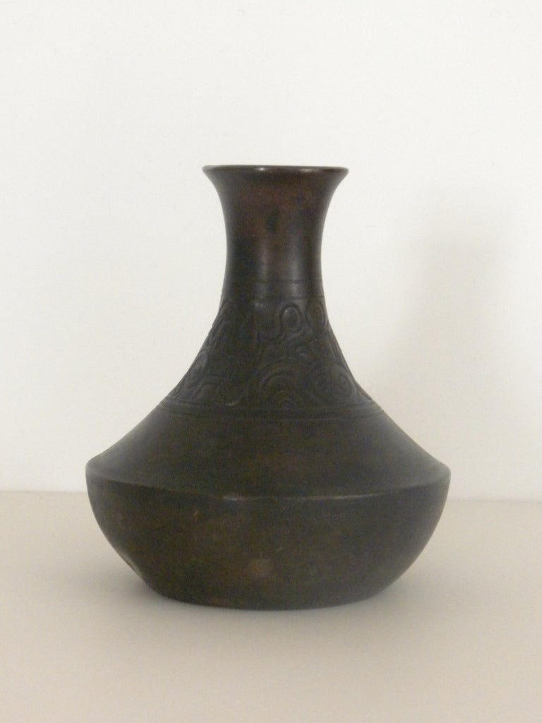 A rare and early hand tooled vase by Just Andersen. Traces of influences from the Pompeian era seen in the shape of the vessel bottom and the center neck of the vase has a hand tooled sinuous pattern reminiscent of the Art Noveau period. Signed at