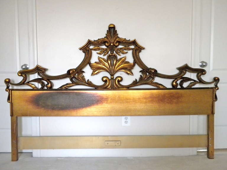 Expertly carved and gilded in the late 1940s by Florence's premier artisans. The delicate woodwork is supported from behind by a network of hand-wrought iron reinforcements. Imported from Italy and sold by Karges Furniture Co.

Fits a KING SIZE