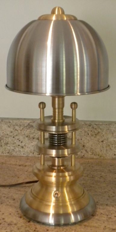 This is a brand new desk lamp made of brushed stainless steel and brass. Exceptional contemporary design.