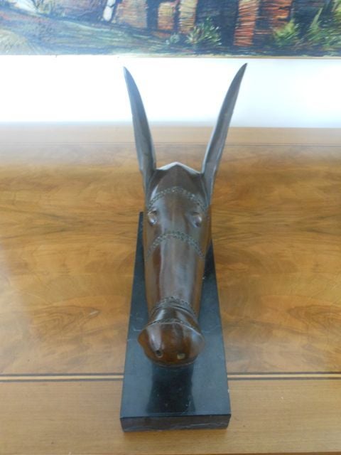 Stylized vintage bronze sculpture of a mule head. Weighs 10 lbs.