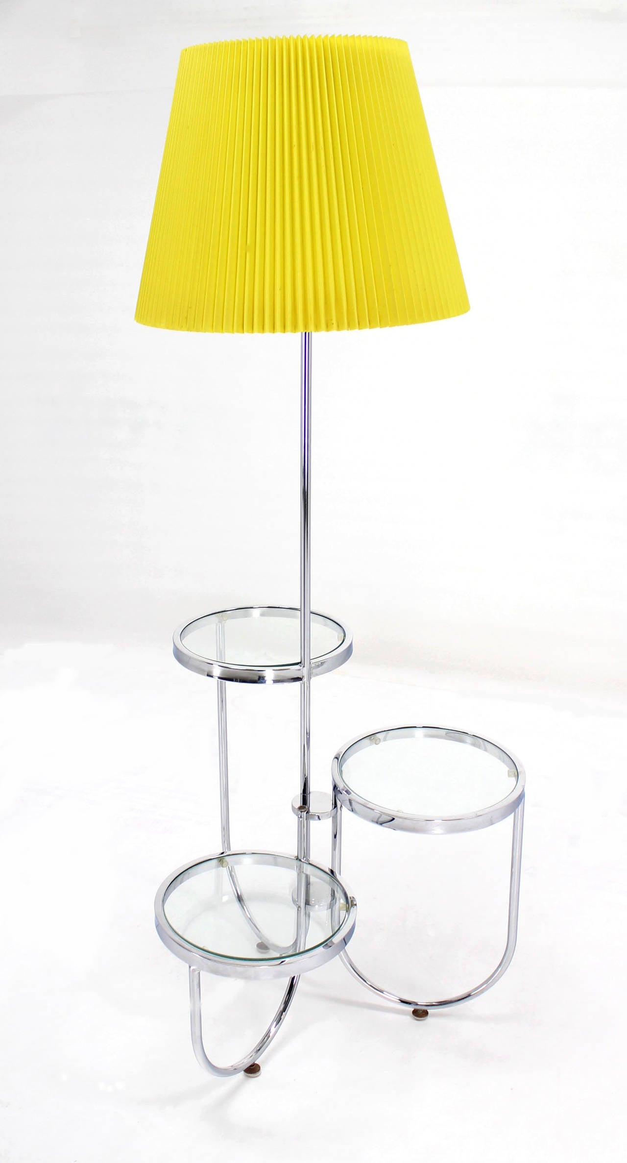 Very cool Mid-Century Modern chrome floor lamp with three round built in tables or stands.