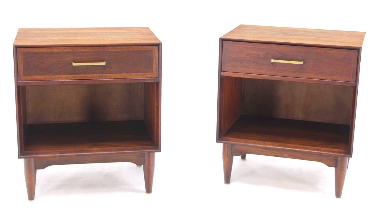 Pair of very nice mid-century modern walnut end tables with brass pulls.