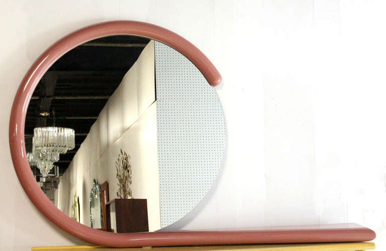 Very unusual circular mirror with shelf or console table vanity. It's a perfect hanging vanity.