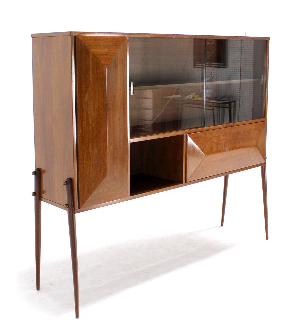 Very nice mid century Italian modern secretary cabinet on long legs.