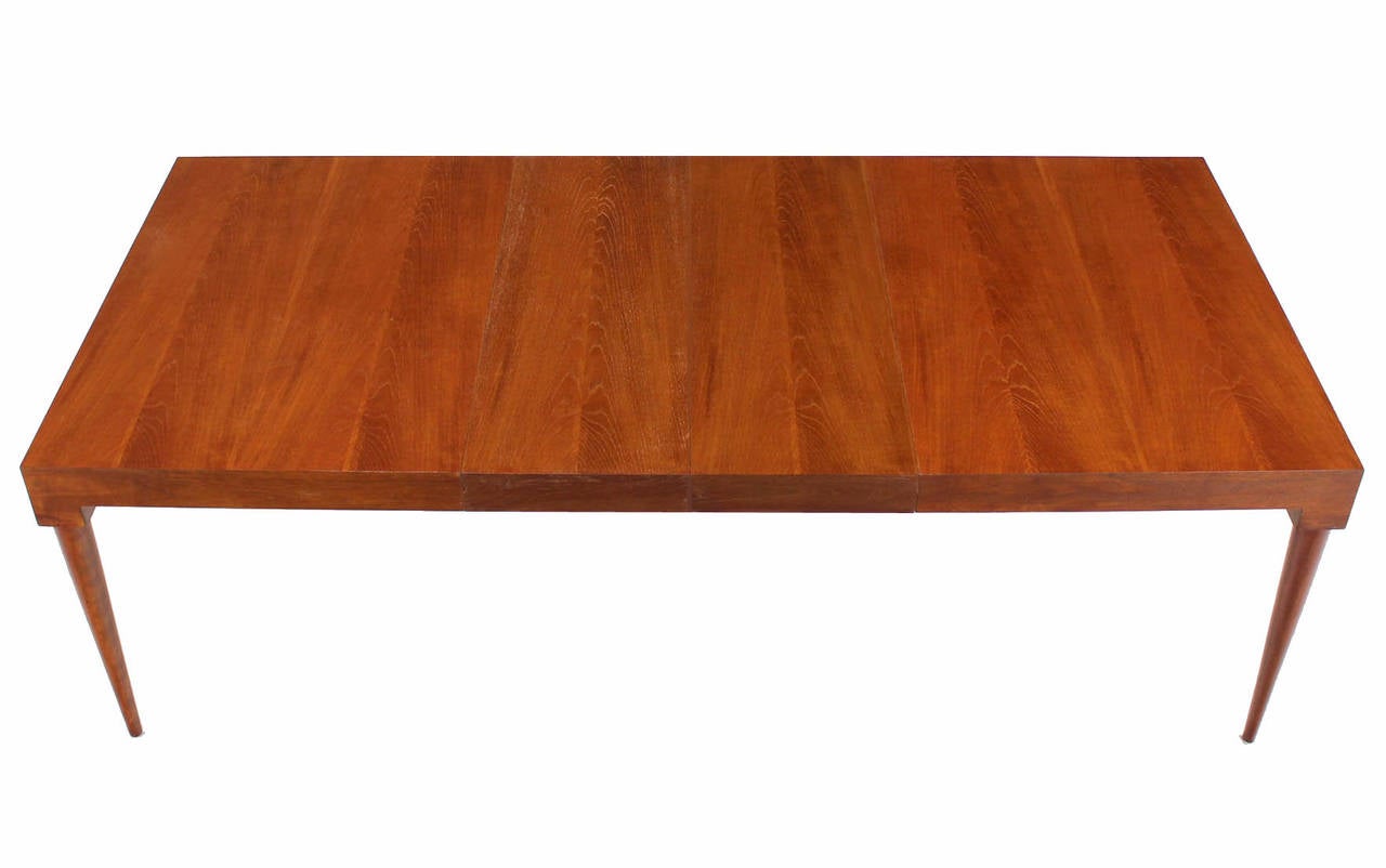 Very nice American modern teak dining table with 2x15" leaves. Excellent condition. Nice round tapered legs.