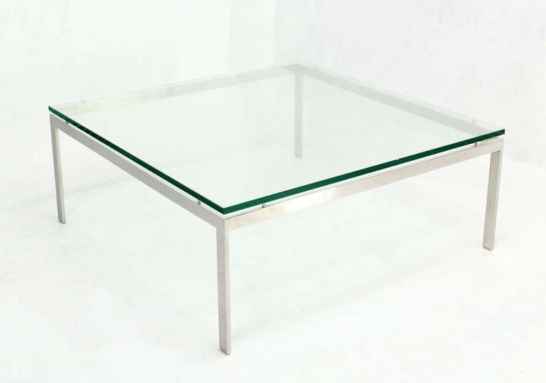 Very nice large square suspended glass top square coffee table.