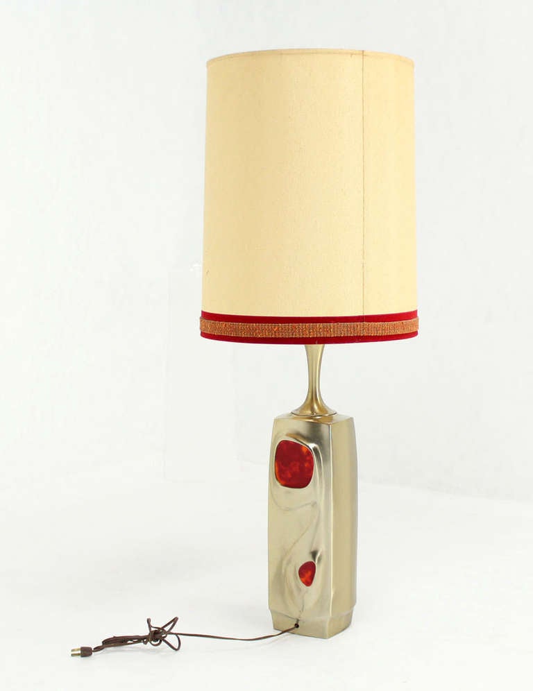 Very unusual cast metal base table lamp.