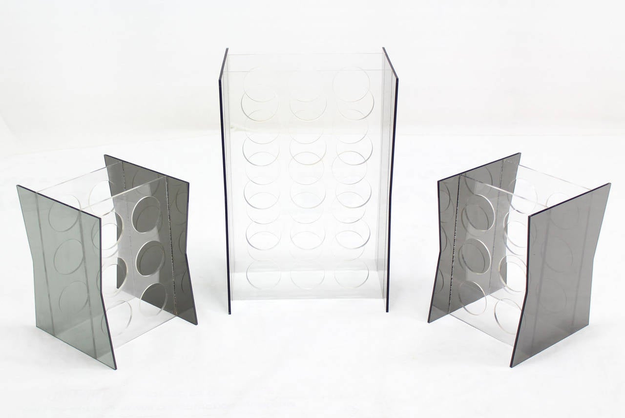 Mid-century modern lucite and smoked lucite wine racks stands.
16x12x24 - 1 piece
11x12x15 - 2 pieces