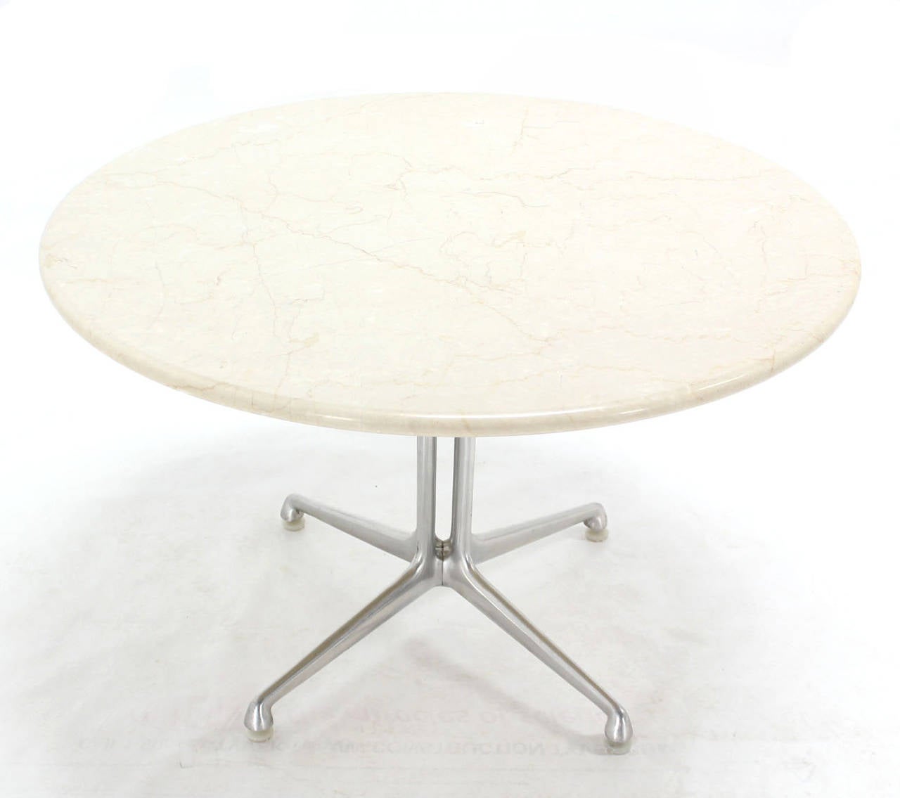 Aluminum Base white marble top La Fonda round coffee table by C. Eames. Excellent vintage condition.