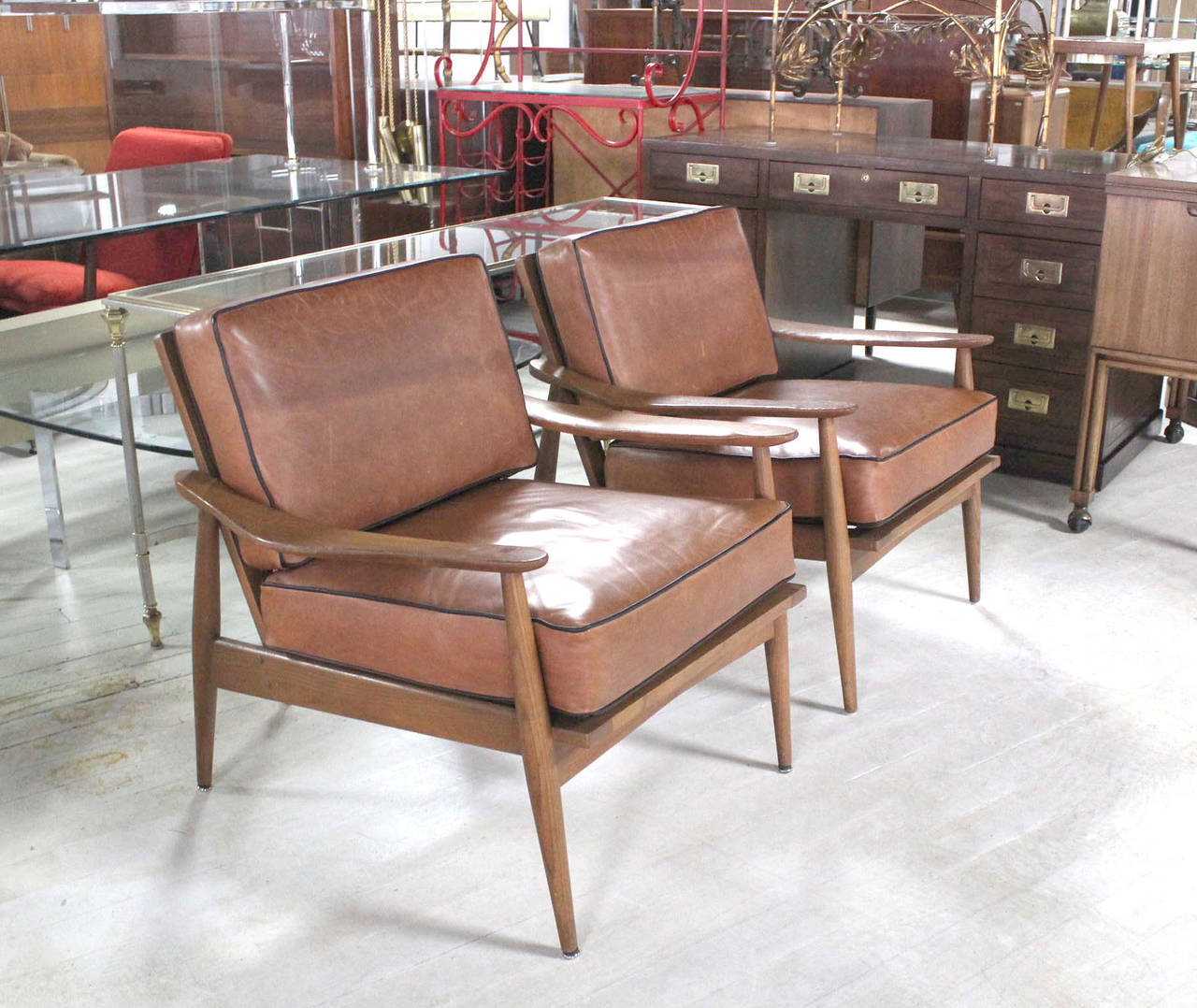 Nice Danish modern lounge chairs with leather upholstery.