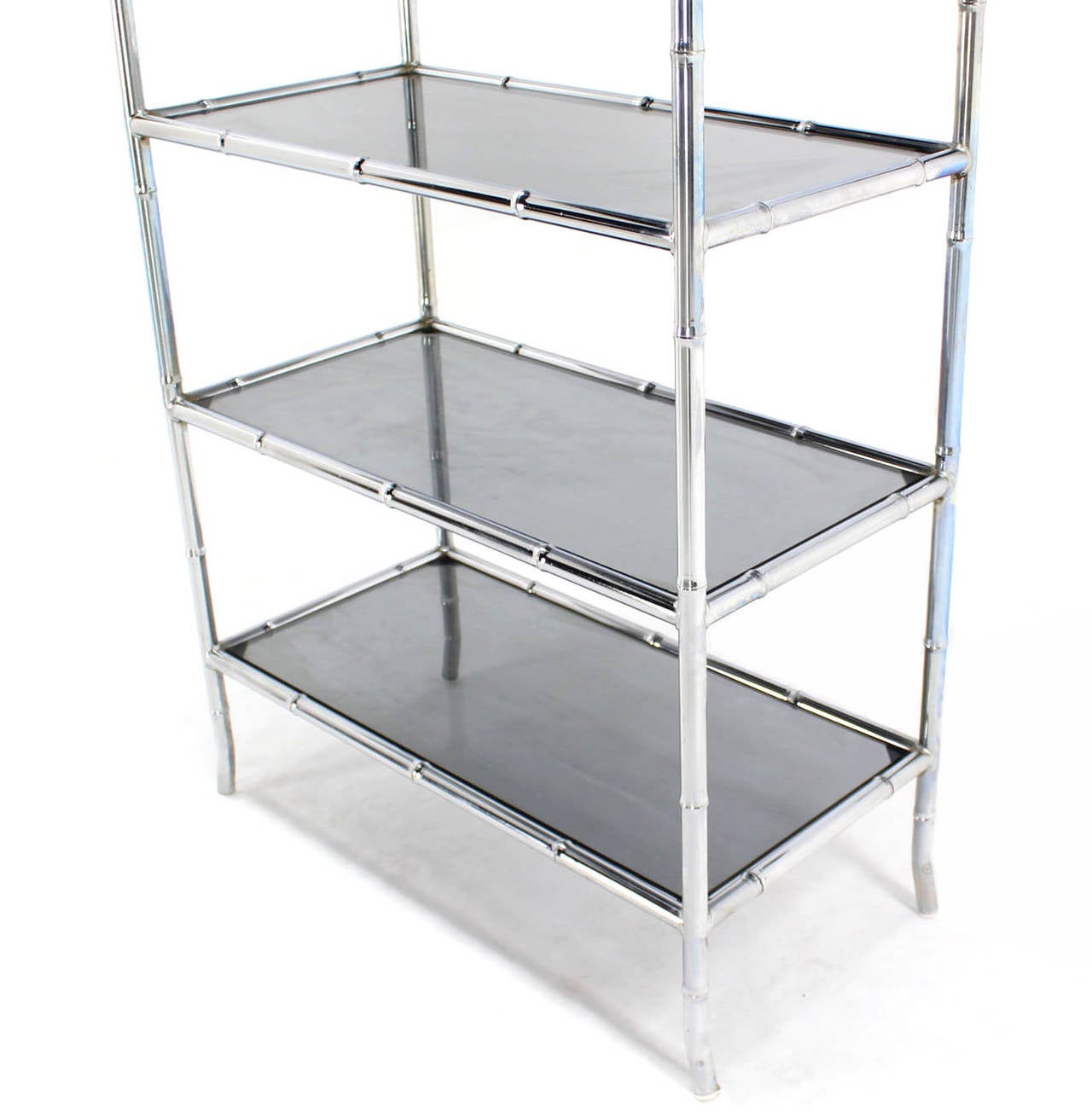 Very nice faux bamboo chrome etagere unit with smoked glass shelves.