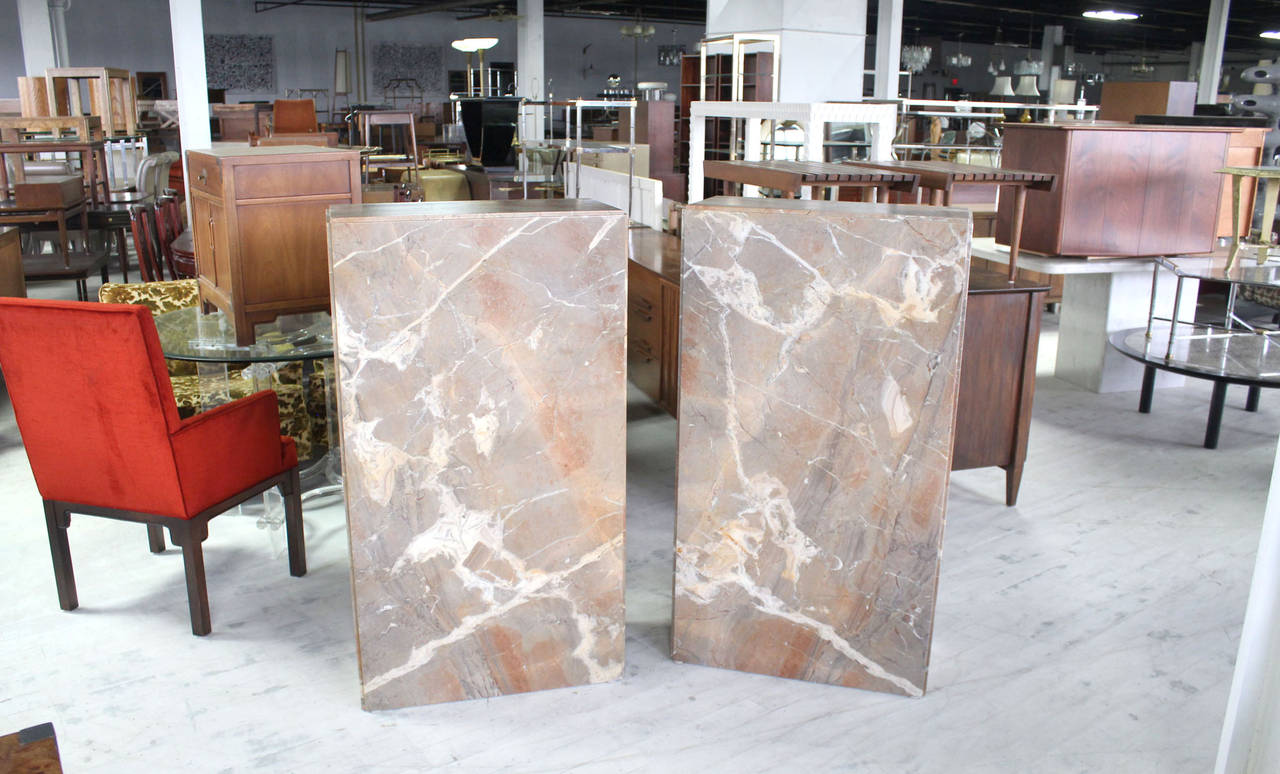Pair of high quality mid-century modern marble pedestals.
They can be used as perfect lamp tables or art work displays, or even as room dividers.

48 Inch Tall, 27 Inch Wide