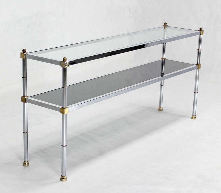 Nice mixed metals glass top console table in style of M. Baughamn.