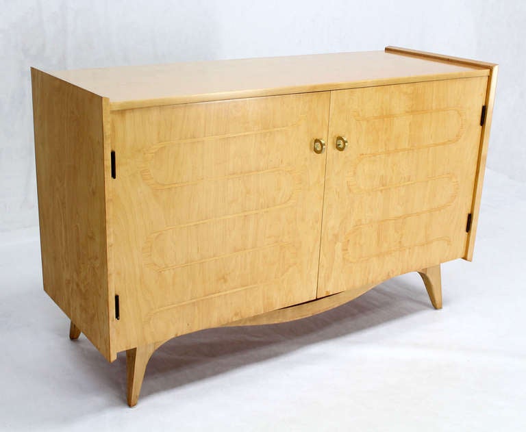 Very nice mid century modern chest of drawers with inlayed front doors and brass hardware.