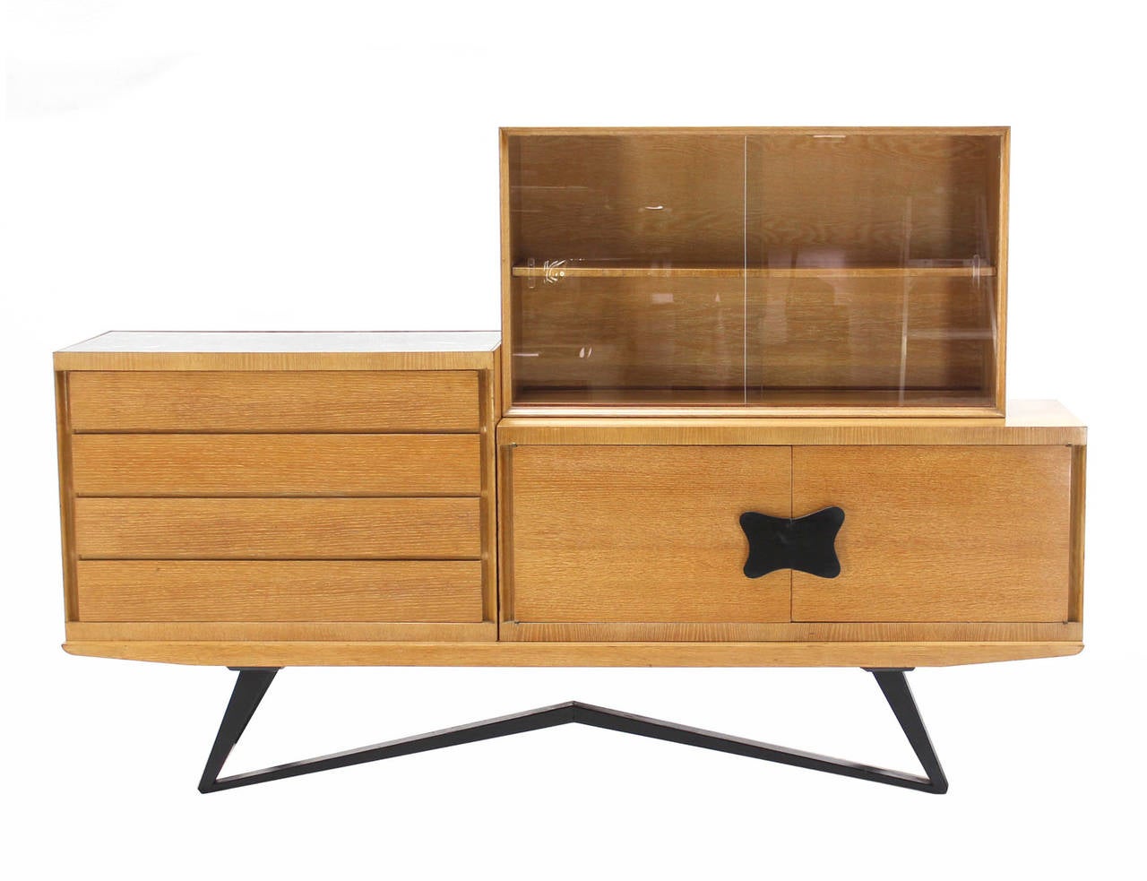 Mid century modern reconfigurable crused oak finish credenza. There are total 3 cabinets and the bench platform bench with bow tie shape legs. Sliding glass doors bookcase compartment. Multifunction credenza with lots  of display possibilities. 