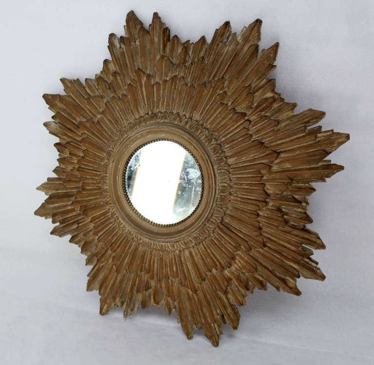 Very nice mid century modern fiberglass composite starburst mirror.
Good vintage condition. The actually mirror started to flake the silver finish.