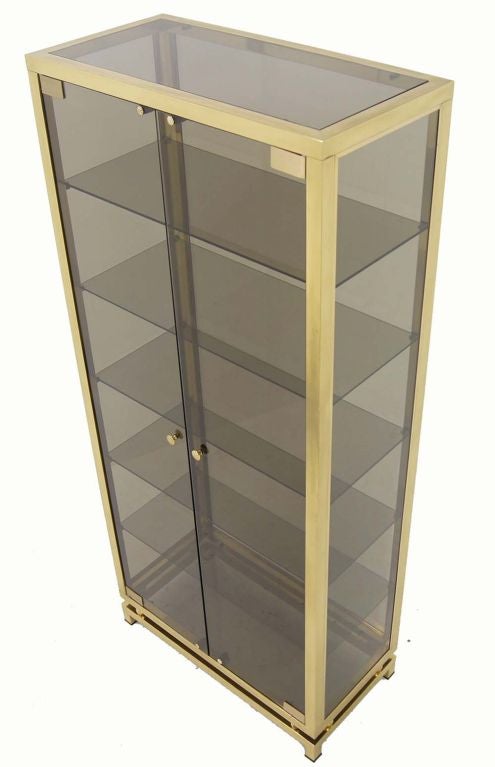 brass and glass curio cabinet