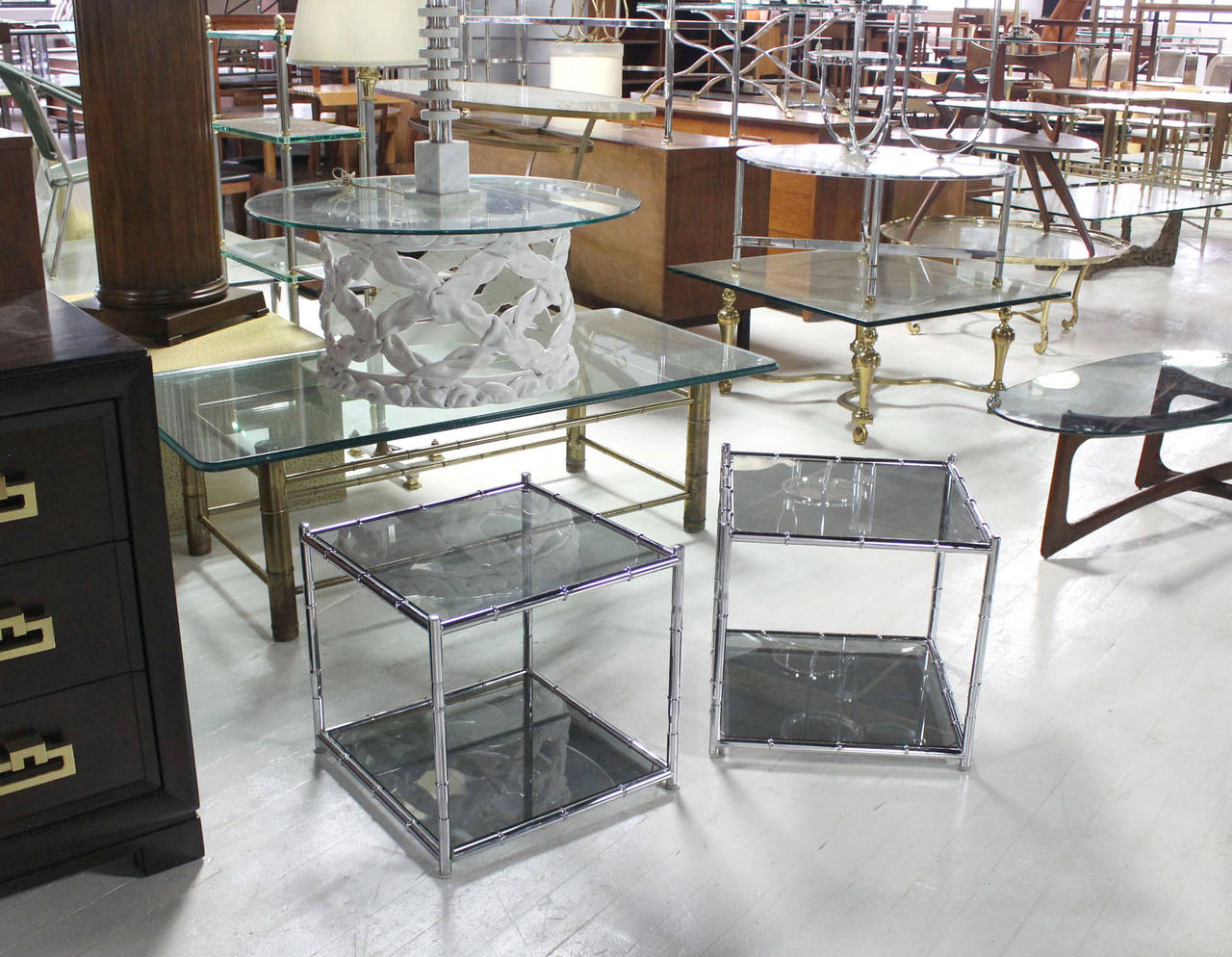 Pair of chrome faux bamboo end tables with smoked glass.