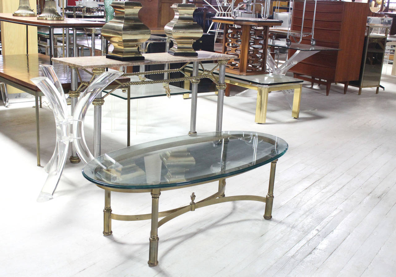 Mid century modern brass base coffee table in style of Jansen.