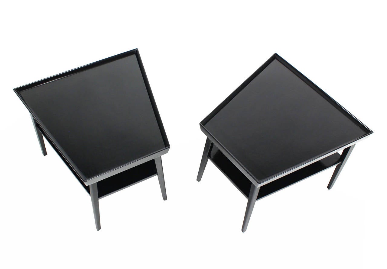 Pair of black lacquer trapezoid shape end tables.