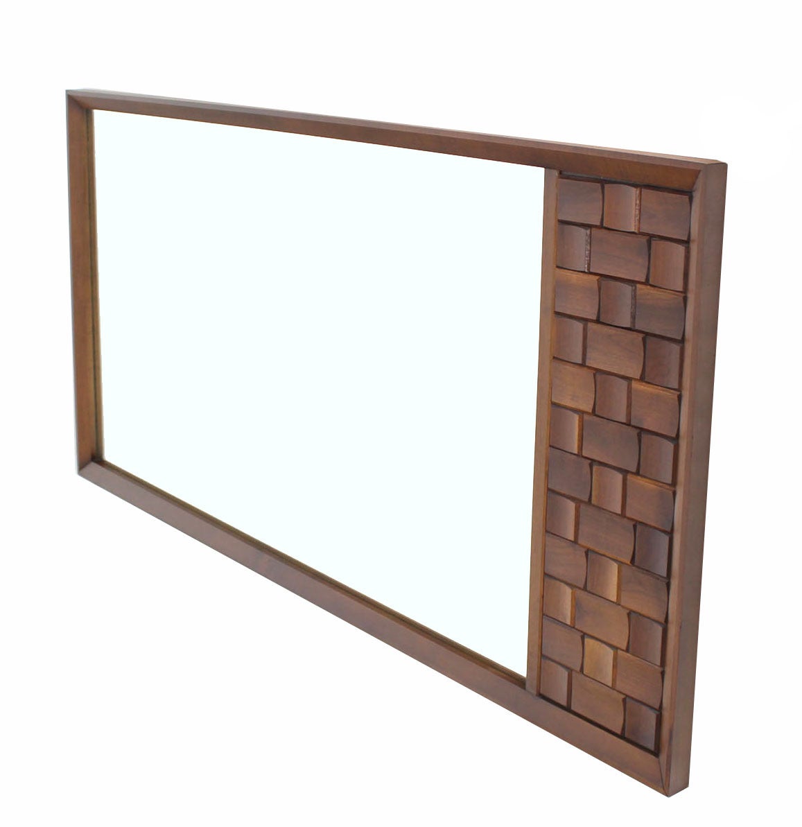 Nice large vintage mid-century modern mirror with solid walnut decorative carving panel.