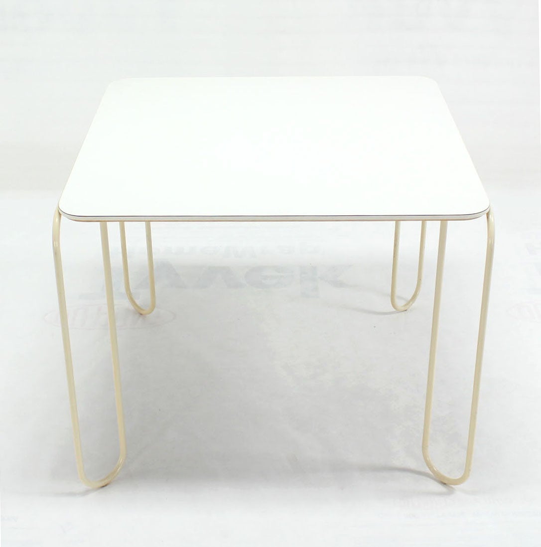 Unusual Mid-Century Modern white top game table on wire legs.