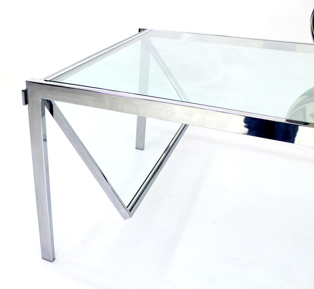Baughman decor chrome and glass dining table with two self containing 22" extensions.