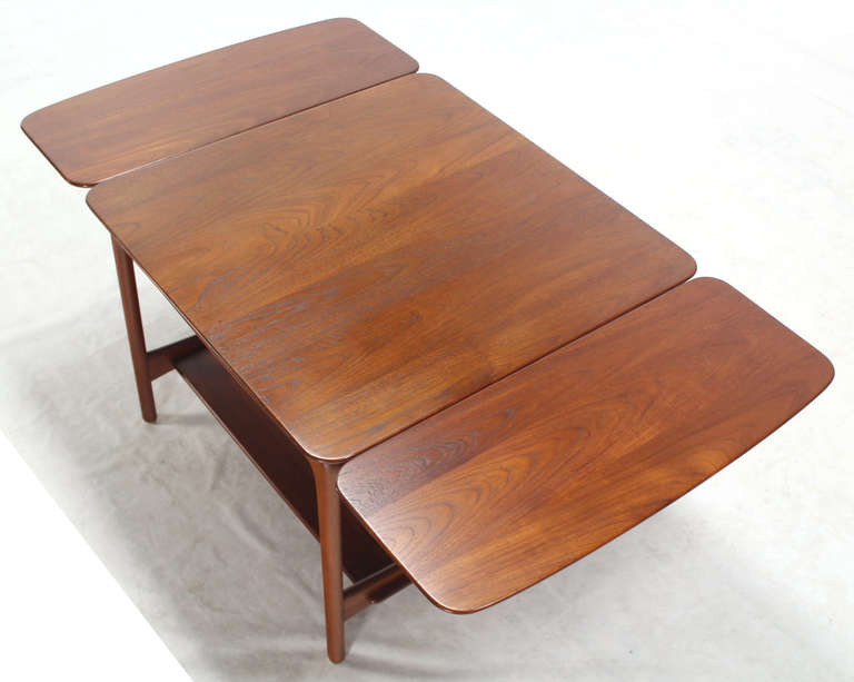 Very nice Mid-Century Modern solid teak square coffee table.
Opened: W54" x D30" x H22"