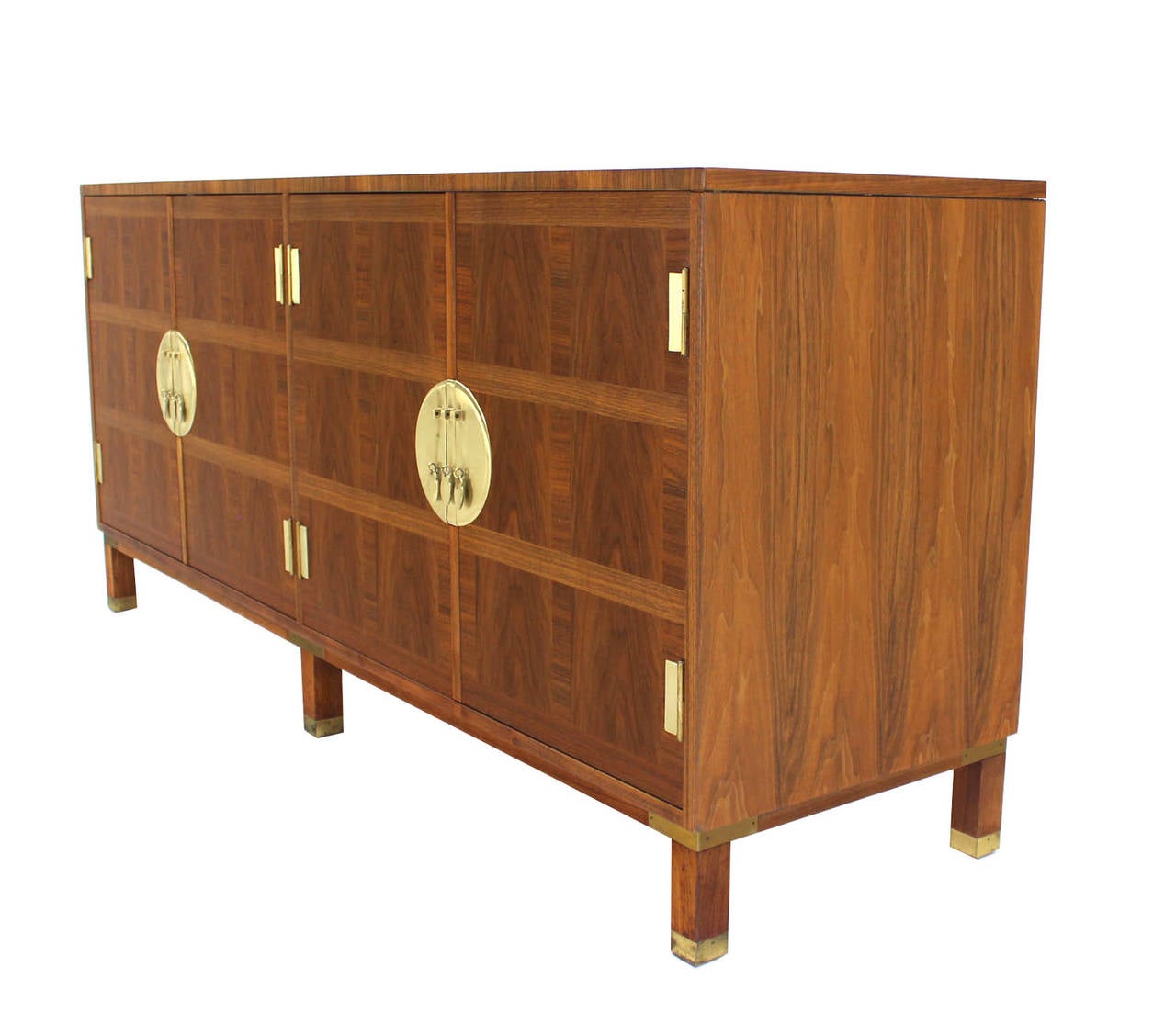 Mid-Century Modern walnut dresser by Baker. Beautiful walnut wood grain and solid brass hardware.
  