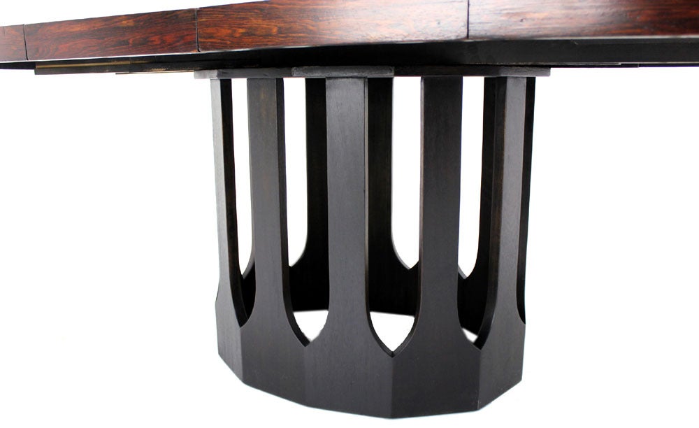 Rosewood top ebonised mahogany base dining room table by Harvey Probber with 2 leafs.