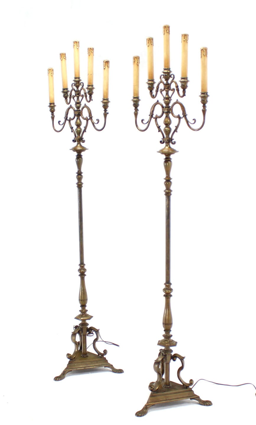 Very nice pair of heavy bronze or brass torcheres on triangular shape bases.