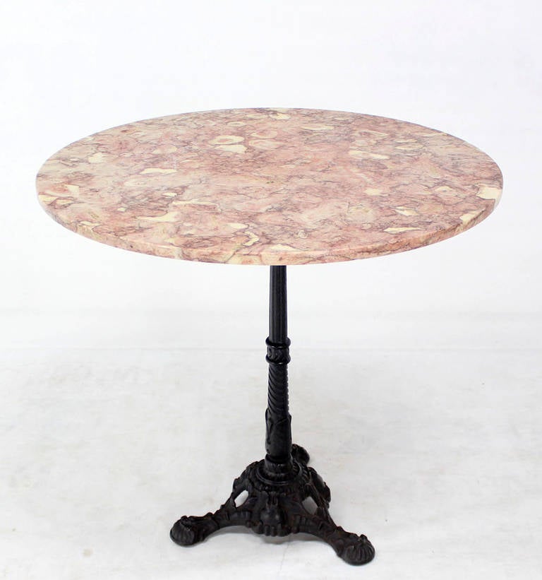 Very nice vintage single pedestal round cafe center lamp table or gueridon with marble top.