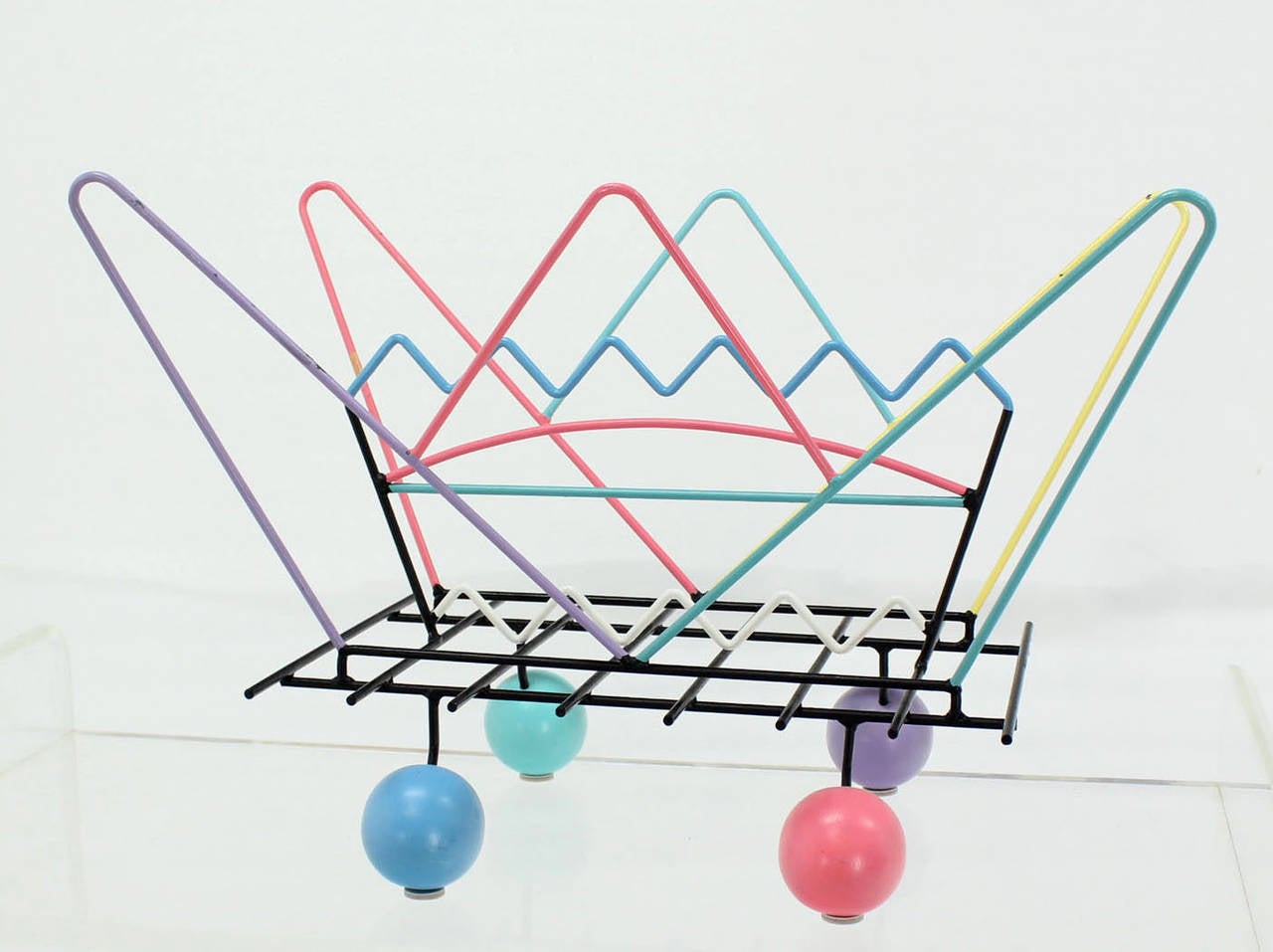 Very nice painted multi colors art memphis style magazine rack.