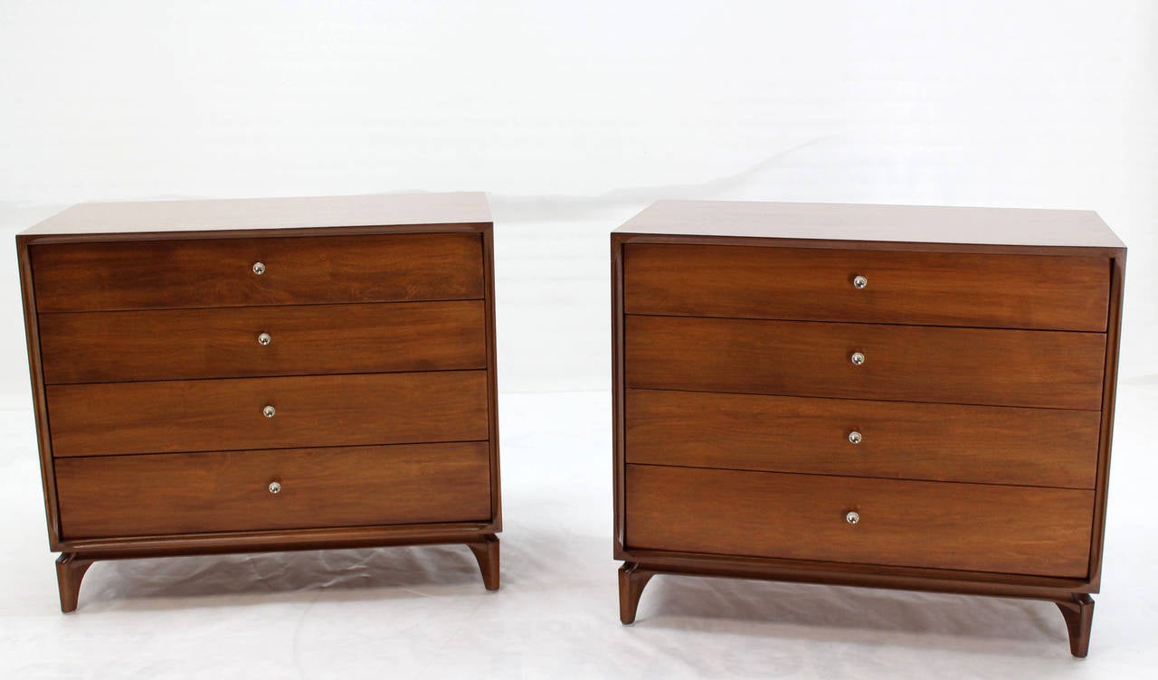 Pair of nice mid century modern bachelor chests or dressers in excellent condition. Beautiful walnut wood grain. Nice brass cone shape pulls.