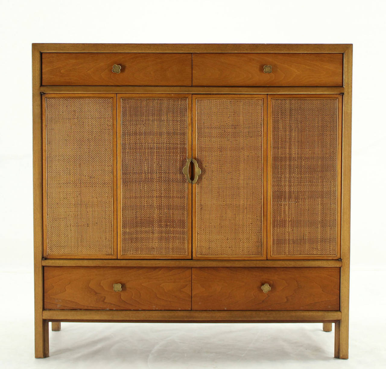 Caned two doors mid century modern chest by Henredon. Light satinwood finish. Decorative figural pulls.