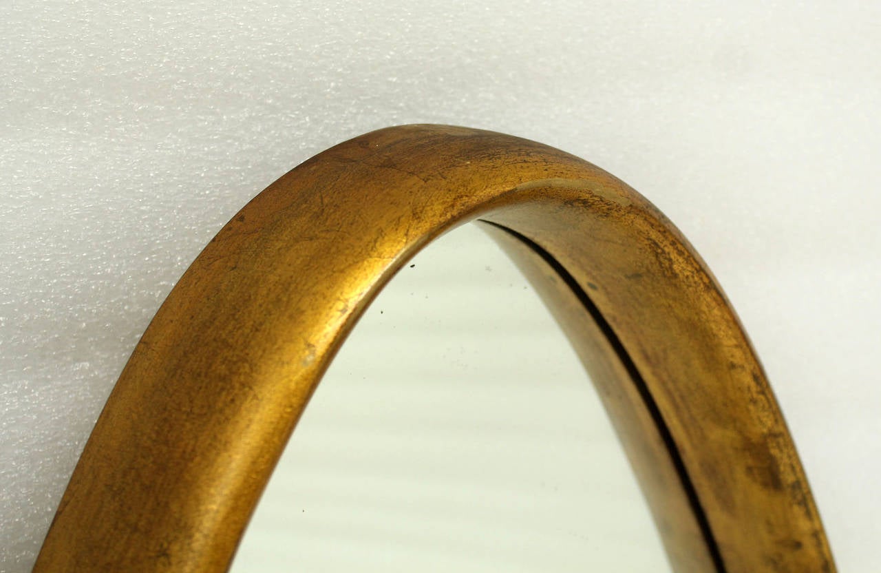 gold framed oval mirror