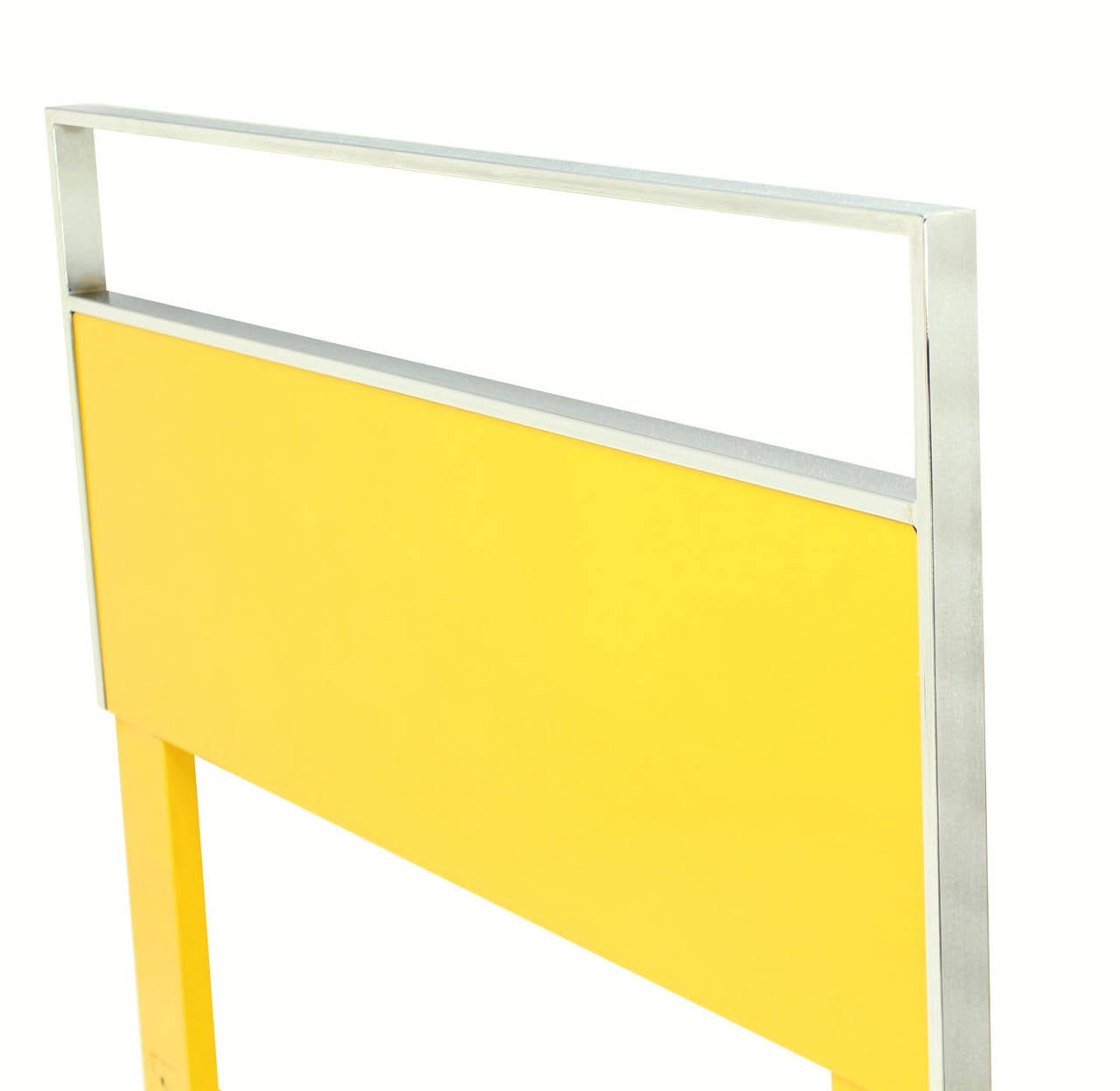 Bright yellow lacquer finish chrome frame twin beds.