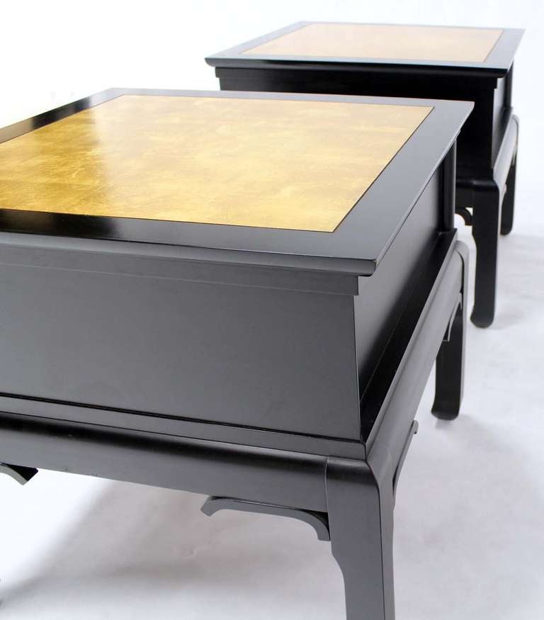 Pair of nice mid century modern black lacquer end tables with gold leaf tops.