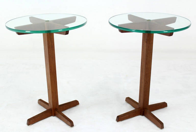 Pair of small X-bases Mid-Century Modern side tables. The glass tops have a hole in the center and secured with a wooden dowel to prevent glass from sliding.