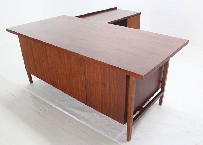 Very nice Mid-Century Modern walnut desk with return in excellent vintage condition.