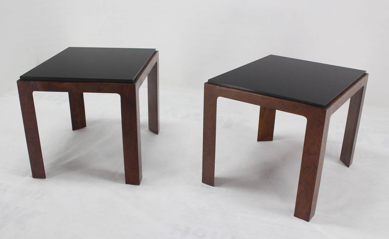 Pair of very nice mid century modern walnut bases end tables with black granite tops.
