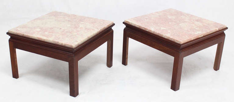 Pair of mid century modern style end tables stands with marble tops.