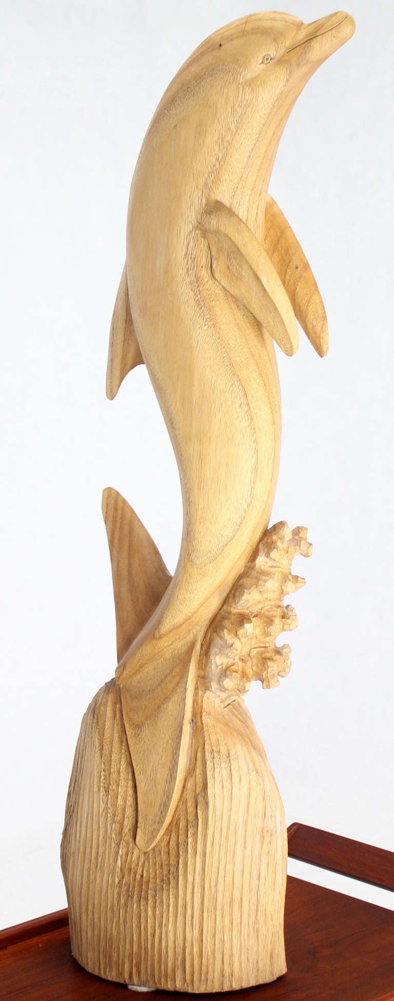 wood dolphin sculpture