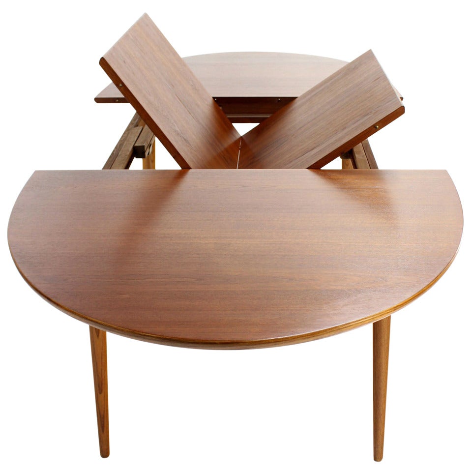 Danish Mid Century Modern Oval Teak Dining Table with One Pop Up Leaf