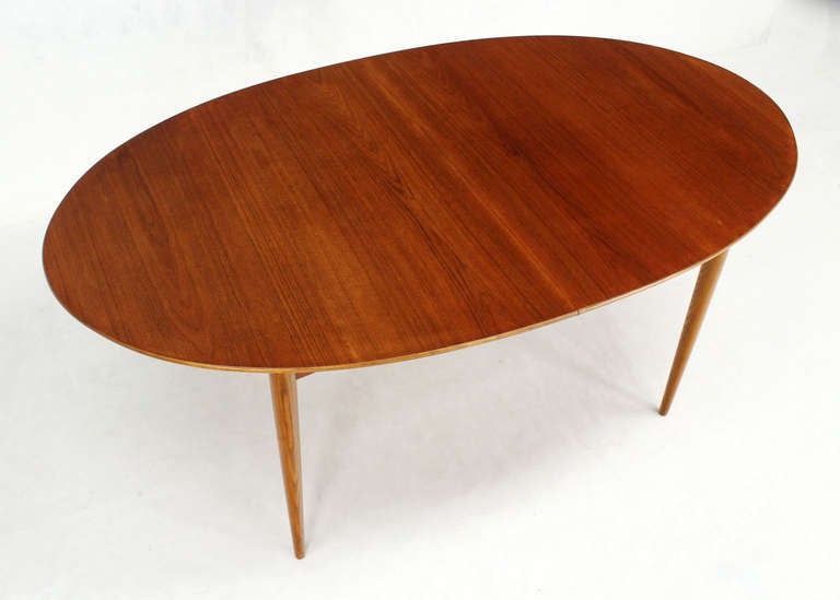 20th Century Danish Mid Century Modern Oval Teak Dining Table with One Pop Up Leaf