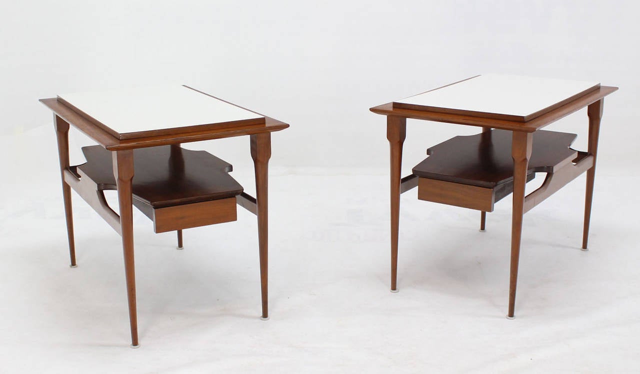 Pair of elegant mid century modern laminated top tapered legs walnut end tables.