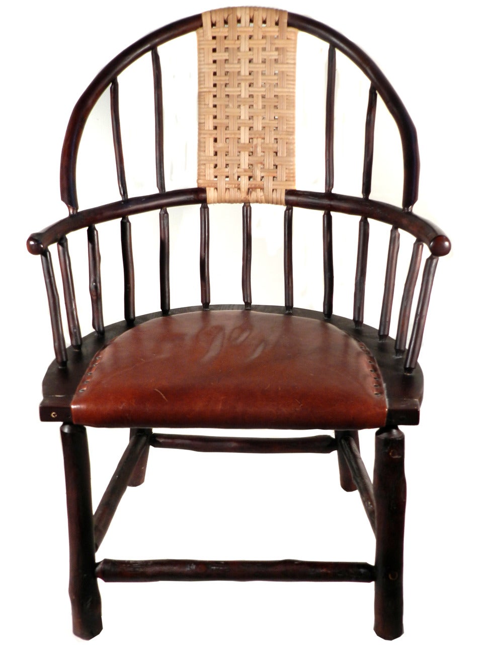 This grand country old hickory Windsor chair is a beautiful combination of hickory, rattan and leather. It was created and signed by Flat Rock Furniture and is their oversized custom 061 Windsor chair. They are the very high end of Adirondack Old